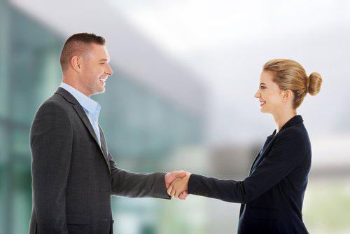 a man and a woman shaking hands