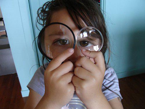 Child with Magnifying Glass